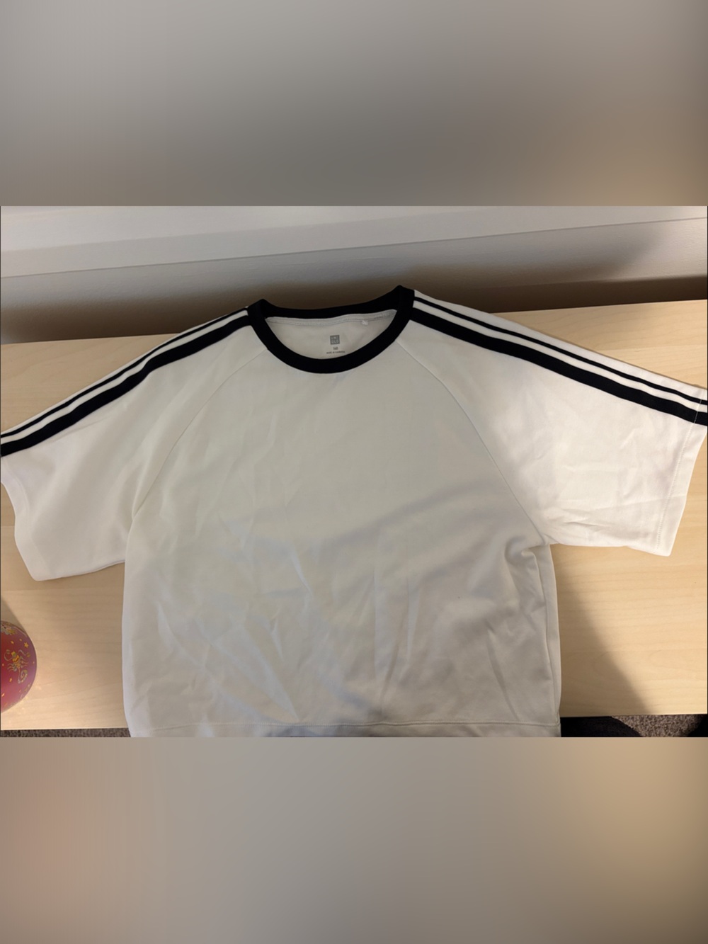 Uniqlo White Tee with Black Trim and Stripes
